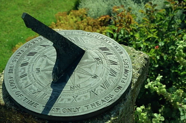 Sundial on plate of slate inscribed Noiseless falls the foot of time that only treads on flowers 1905, Little Hall, Lavenham, Suffolk, England, United