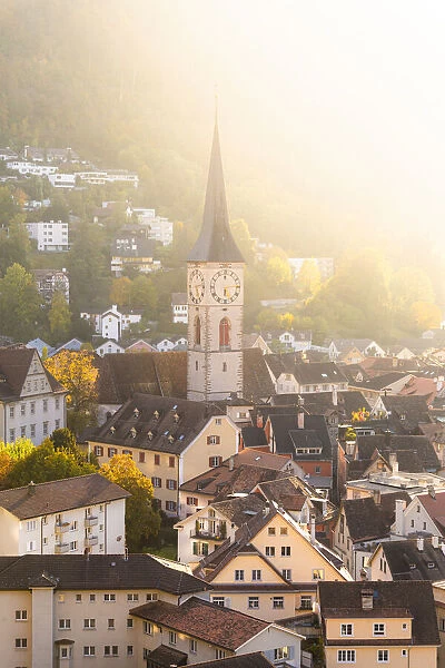 Sunlight illuminates the old town of Chur, Canton Graubunden, Switzerland, Europe