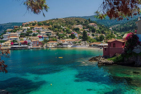 Sunny view of traditional Asos Village with low-rise houses by the sea in Kefalonia village, Kefalonia, Ionian Islands, Greek Islands, Greece, Europe