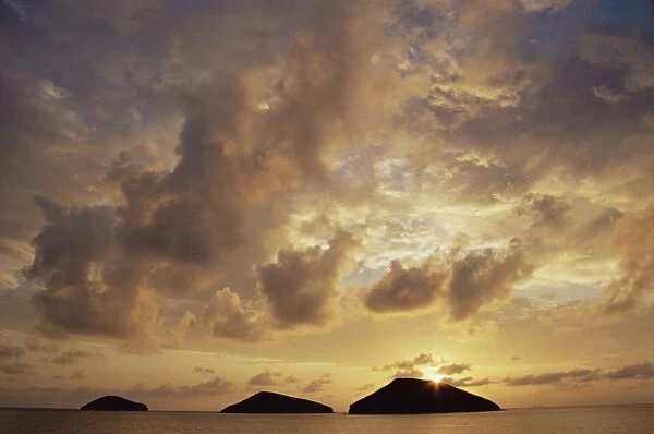 Sunrise behind Bainbridge Rocks, off James Island, Galapagos Islands, UNESCO World Heritage Site