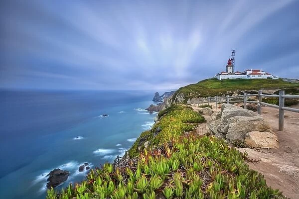 Sunrise on the cape and lighthouse of Cabo da Roca overlooking the Atlantic Ocean