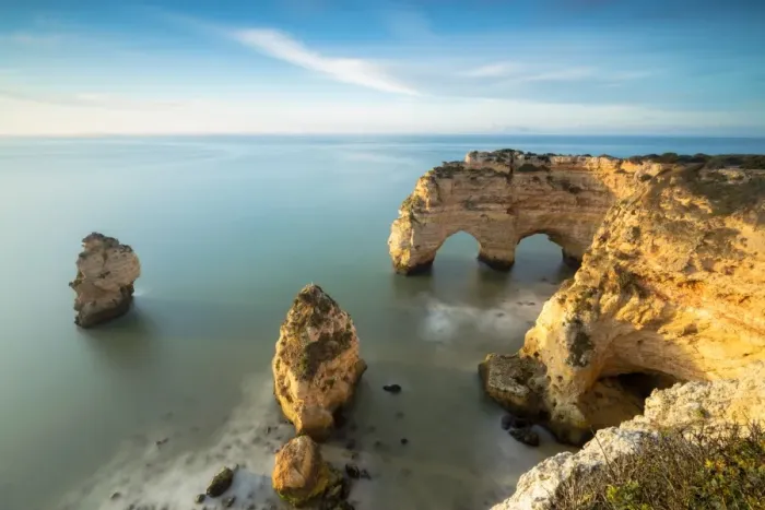 Framed Print : Sunrise on cliffs framed by turquoise water of the ocean, Praia da Marinha, Caramujeira Framed Print : Sunrise on cliffs framed by turquoise water of the ocean, Praia da Marinha, Caramujeira