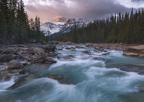 Sunrise and glacial blue rushing waters at Mistaya Canyon, Banff National Park, UNESCO