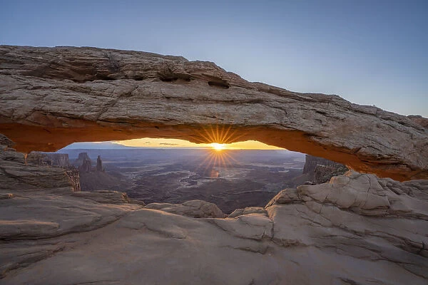Sunrise at Mesa Arch with glowing arch and sunburst, Canyonlands National Park, Utah