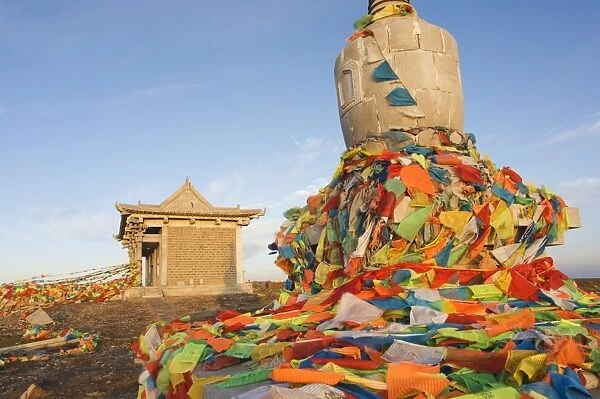 Sunrise on a monastery stupa and prayer flags on Yedou Peak, 3058m, at Wutaishan