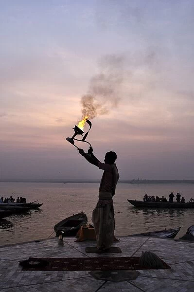 Sunrise ritual at the River Ganges, Varanasi (Benares), Uttar Pradesh, India, Asia