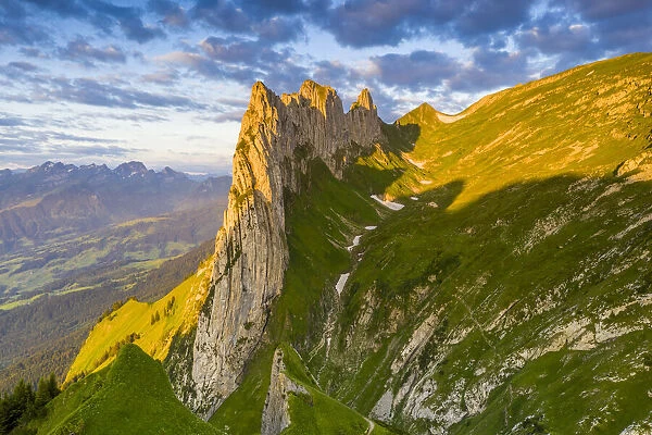 Sunrise on rocky peak of Saxer Lucke mountain in summer, Appenzell Canton, Alpstein Range