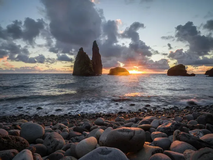 Framed Print : Sunrise below sea stacks from the pebble beach of Bahia da Alagoa, Flores island, Azores islands, Portugal, Atlantic Ocean, Europe