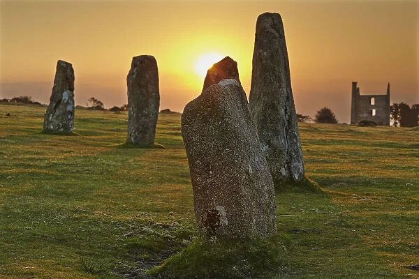 Sunrise over standing stones at the Hurlers, a series of prehistoric stone circles