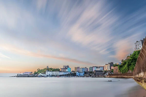 Sunrise over Tenby's harbour on a calm summer morning, a holiday destination on the south coast of Wales, Tenby, Pembrokeshire, Wales, United Kingdom, Europe