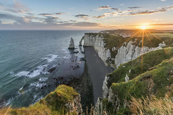 Sunrrays at dawn at the cliffs, Etretat, Normandy, France, Europe