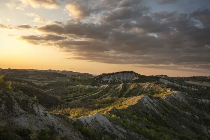 Framed Print : Sunset above badlands and countryside with colored clouds in the sky, Bologna, Emilia Romagna, Italy, Europe Framed Print : Sunset above badlands and countryside with colored clouds in the sky, Bologna, Emilia Romagna, Italy, Europe