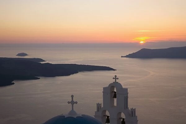 Sunset over the caldera, typical church in foreground, Firostefani, Santorini (Thira) (Thera), Cyclades Islands, South Aegean, Greek Islands, Greece, Europe