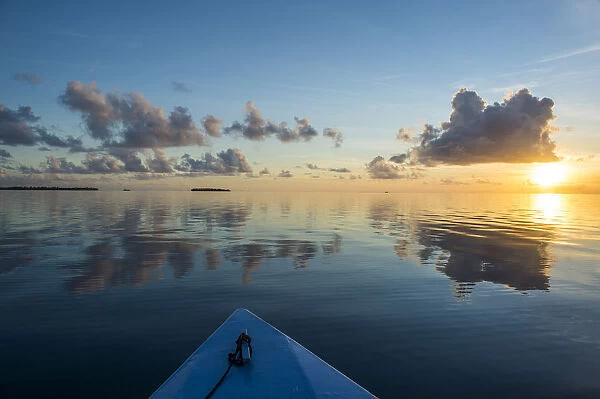 Sunset over the calm waters of Tikehau, Tuamotus, French Polynesia, Pacific