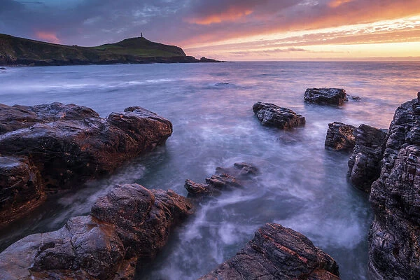 Sunset over Cape Cornwall from the rocky shores of Porth Ledden, Cornwall, England, United Kingdom, Europe