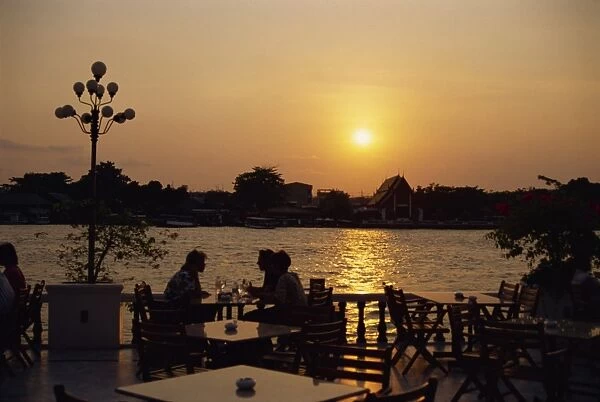 Sunset over the Chao Phya River from the terrace of