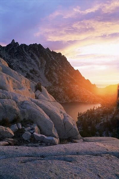 Sunset over granite rock and alpine lakes