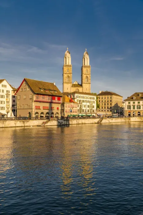 Framed Print : Sunset over Grossmunster Cathedral and Limmatquai street along the banks of Limmat River Framed Print : Sunset over Grossmunster Cathedral and Limmatquai street along the banks of Limmat River