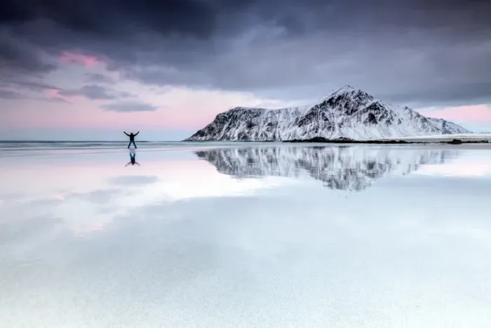 Framed Print : Sunset and hiker on Skagsanden beach surrounded by snow covered mountains, Flakstad Framed Print : Sunset and hiker on Skagsanden beach surrounded by snow covered mountains, Flakstad