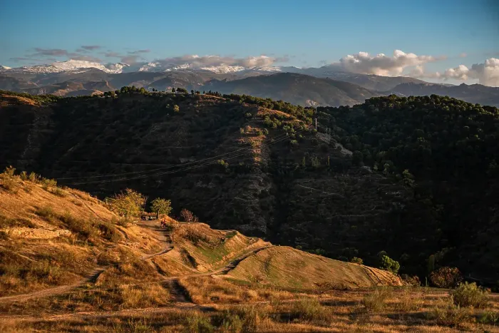 Framed Print : Sunset over the hills behind Granada and wide landscapes with the snowy Sierra Nevada behind, Granada, Andalusia, Spain