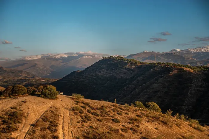 Framed Print : Sunset over the hills behind Granada and wide landscapes with the snowy Sierra Nevada behind, Granada, Andalusia, Spain Framed Print : Sunset over the hills behind Granada and wide landscapes with the snowy Sierra Nevada behind, Granada, Andalusia, Spain