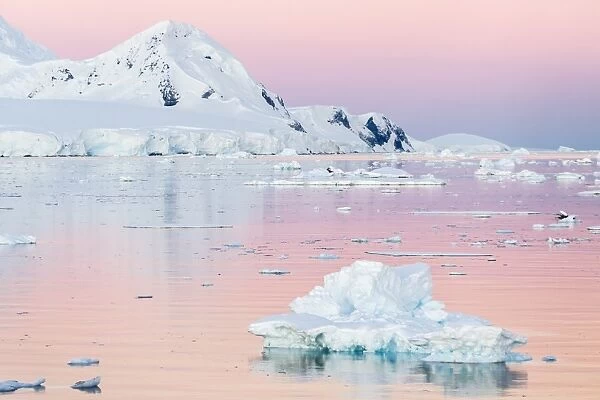 Sunset over icebergs in the Gerlache Strait, Antarctica, Southern Ocean, Polar Regions