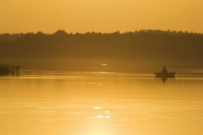 Framed Print : Sunset on lake and fishing boat Framed Print : Sunset on lake and fishing boat
