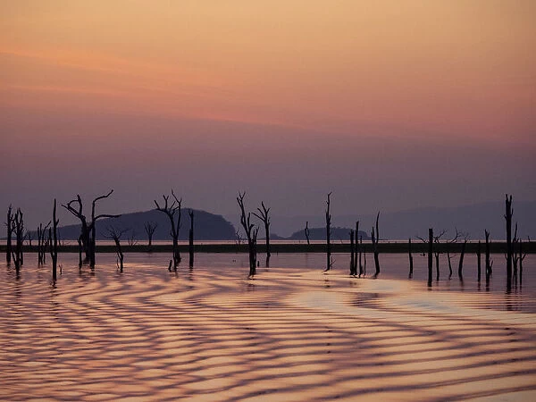 Sunset over Lake Kariba, the worlds largest man-made lake and reservoir by volume