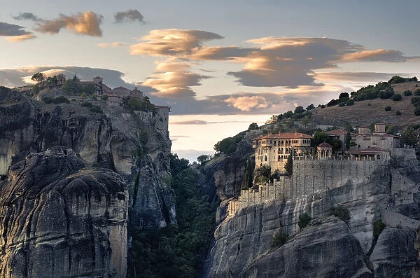 Sunset light on clouds and Varlaam and Megalo Meteoro Monasteries, Meteora