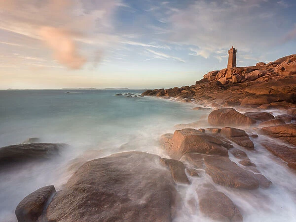 Sunset long exposure at Ploumanach lighthouse with the pink granite coast, Cotes d Armor, Brittany, France, Europe