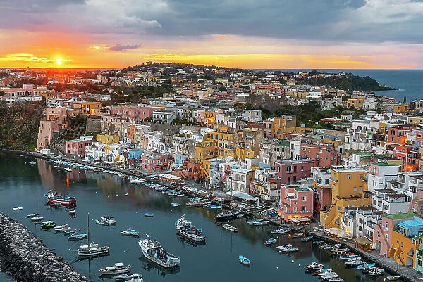 Sunset on Marina Corricella, the famous colourful fishing village on Procida island, Tyrrhenian Sea, Naples district, Naples Bay, Campania region, Italy, Europe