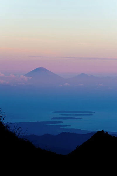 Sunset over Mount Agung and Mount Batur on Bali, and the Three Gili Isles taken from Mount Rinjani, Lombok, Indonesia, Southeast Asia, Asia