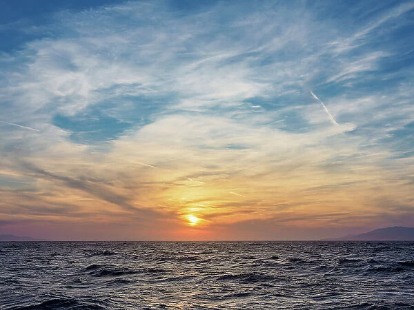 Sunset near the coast of Mykonos Island, Cyclades, Greek Islands, Greece, Europe
