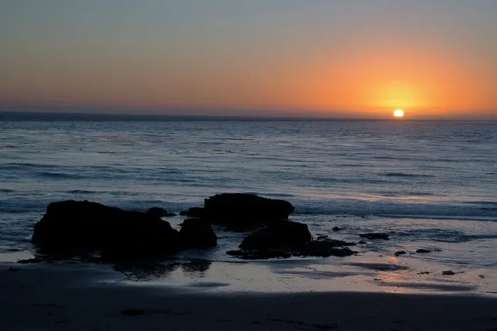 Framed Print : Sunset over the ocean, with rocks in the foreground, San Simeon, California, United States of America, North America Framed Print : Sunset over the ocean, with rocks in the foreground, San Simeon, California, United States of America, North America