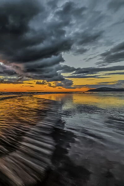 Sunset from Sandy Gap on Walney Island, view towards the distant Black Combe across the Irish Sea, Duddon Estuary and Cumbrian Coast, Cumbria, England, United Kingdom, Europe