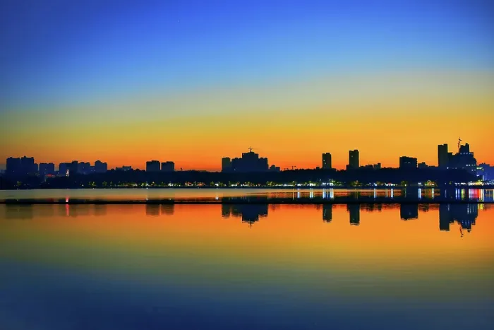 Framed Print : Sunset silhouette of Jiujiang City over Bali Lake, Jiangxi Province, China Framed Print : Sunset silhouette of Jiujiang City over Bali Lake, Jiangxi Province, China