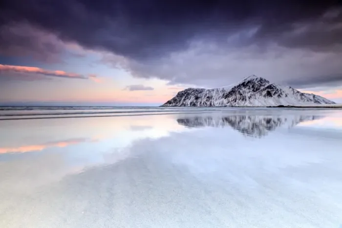 Framed Print : Sunset on Skagsanden beach surrounded by snow covered mountains reflected in the cold sea Framed Print : Sunset on Skagsanden beach surrounded by snow covered mountains reflected in the cold sea