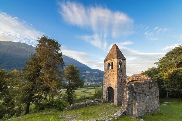 Sunset sky frames the ancient Abbey of San Pietro in Vallate, Piagno, Sondrio province