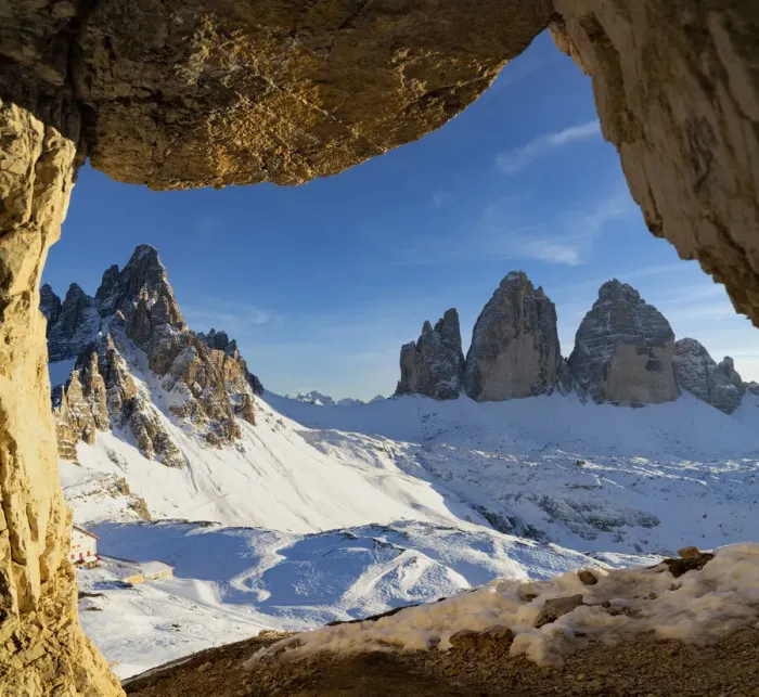 Framed Print : Sunset over the snow capped Tre Cime di Lavaredo and Monte Paterno seen from rock cave Framed Print : Sunset over the snow capped Tre Cime di Lavaredo and Monte Paterno seen from rock cave