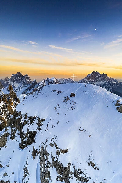 Sunset over the snowy peak of Nuvolau with Monte Pelmo and Civetta on background