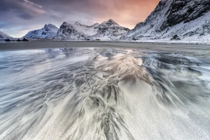 Framed Print : Sunset on the surreal Skagsanden beach surrounded by snow covered mountains, Flakstad