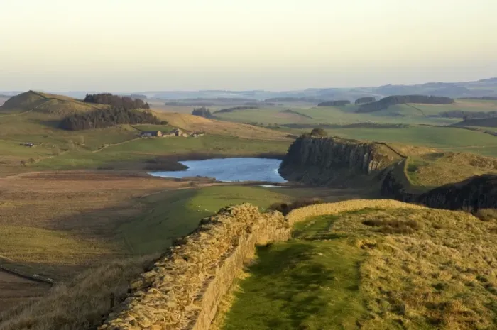 Framed Print : Towards sunset, view east along Hadrians Wall from Windshields Crag to Crag Lough and Hotbank Farm, UNESCO World Heritage Site, Northumberland National Park, Northumbria, England, United Kingdom, Europe