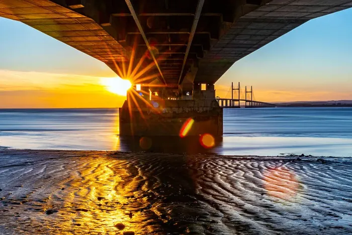 Framed Print : Sunset view under a pier with sunburst effect, reflecting on wet sand and calm water, Prince of Wales Bridge, the Second Severn Crossing, M4 motorway over the River Severn, between England and Wales, United Kingdom, Europe Framed Print : Sunset view under a pier with sunburst effect, reflecting on wet sand and calm water, Prince of Wales Bridge, the Second Severn Crossing, M4 motorway over the River Severn, between England and Wales, United Kingdom, Europe