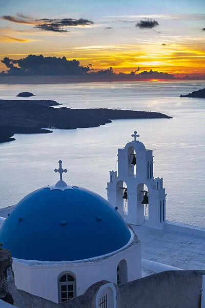 Sunset over the volcanic island of Santorini and Anastasi Orthodox Church at sunset, Fira