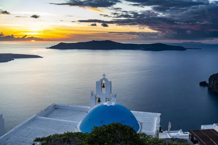 Framed Print : Sunset over the volcanic islands of Santorini and Anastasi Orthodox Church at sunset Framed Print : Sunset over the volcanic islands of Santorini and Anastasi Orthodox Church at sunset