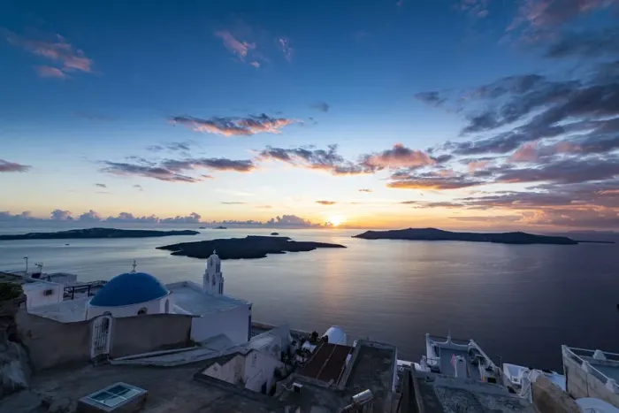 Framed Print : Sunset over the volcanic islands of Santorini and Anastasi Orthodox Church at sunset Framed Print : Sunset over the volcanic islands of Santorini and Anastasi Orthodox Church at sunset