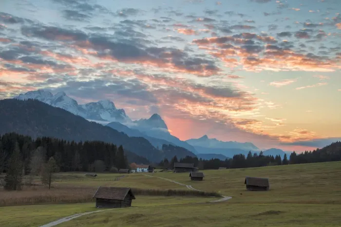 Framed Print : Sunset on wooden huts and meadows with the Alps in background, Geroldsee, Krun, Garmisch Framed Print : Sunset on wooden huts and meadows with the Alps in background, Geroldsee, Krun, Garmisch
