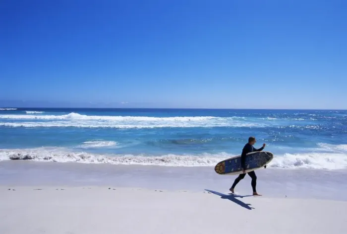 Framed Print : Surfer walking with his board on Kommetjie beach Framed Print : Surfer walking with his board on Kommetjie beach