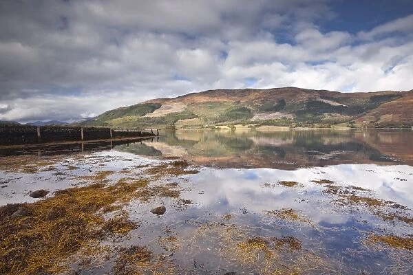 The surrounding countryside and hills are reflected in Loch Leven, Argyll and Bute, Scotland, United Kingdom, Europe
