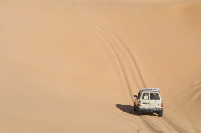 Framed Print : SUV on sand dunes